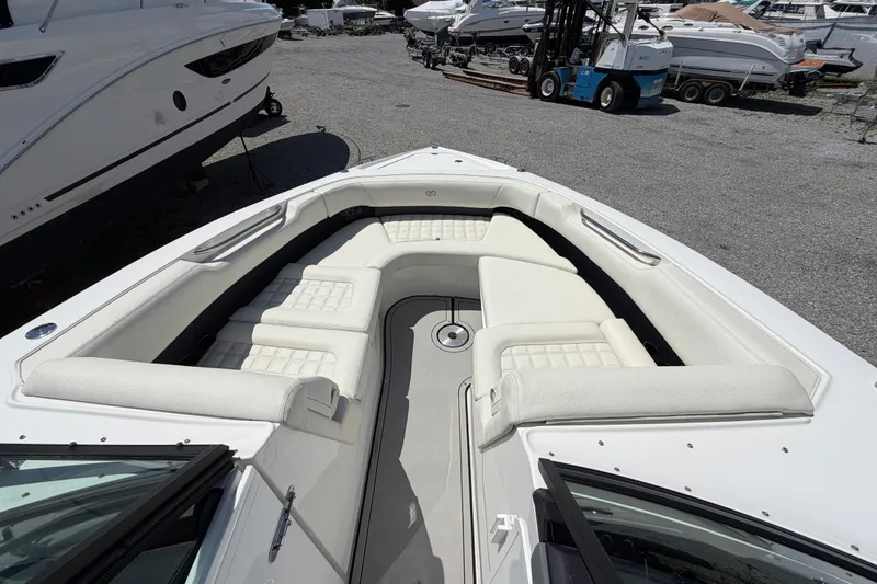 Slide: The Image of 2021 Cobalt 30SC boat with spacious white seating and sleek design. - 35