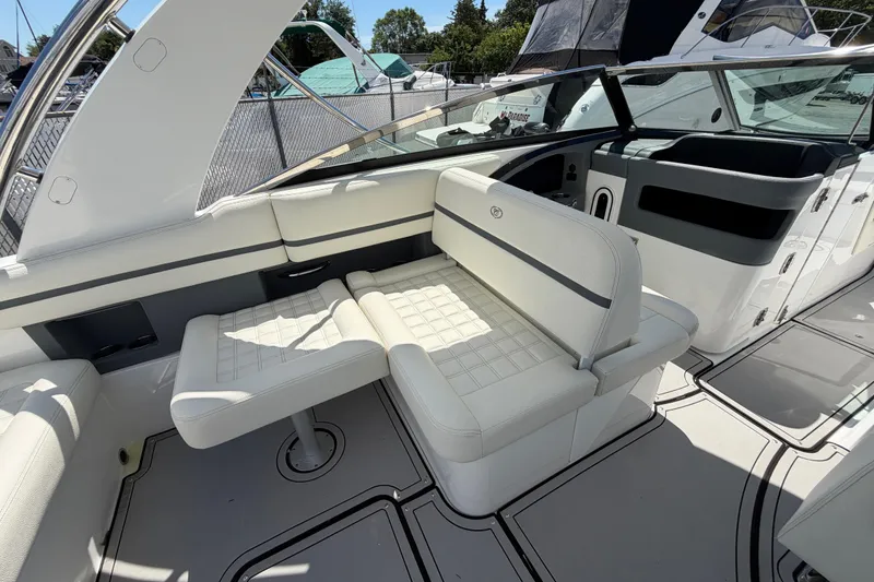 Slide: The Image of 2021 Cobalt 30SC boat interior with white seating and sleek design. - 21