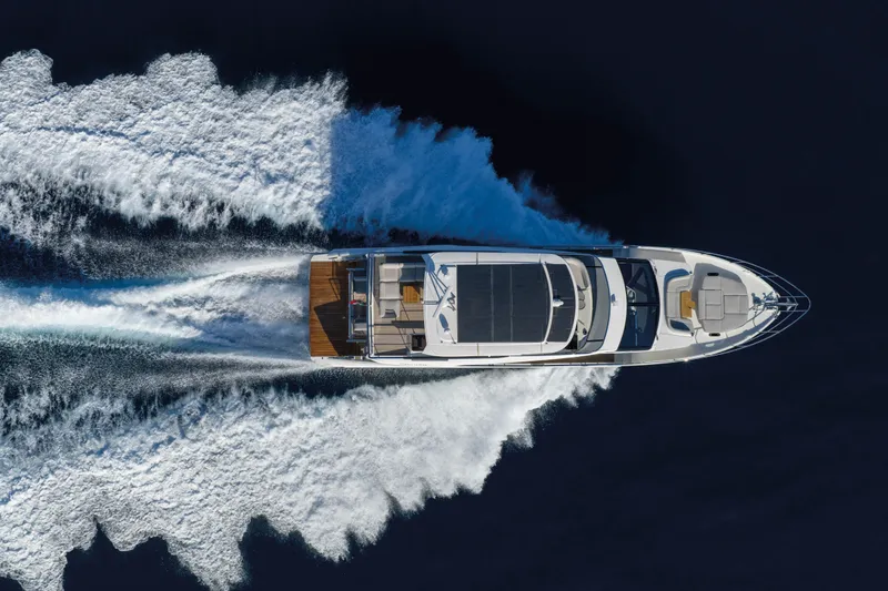 Slide: The Image of Aerial view of 2027 Absolute 70 Fly yacht cruising on open water. - 10