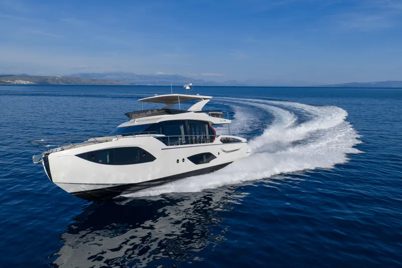 Slide: The Image of Luxury Absolute 70 Fly yacht cruising on open sea, 2027 model. - 11