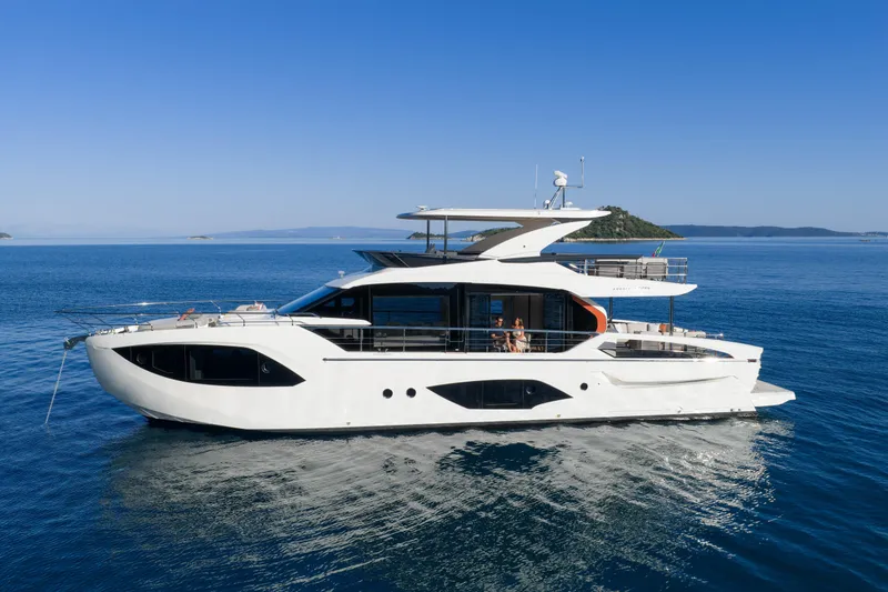 Slide: The Image of Luxury Absolute 70 Fly yacht cruising on serene blue waters, 2027 model. - 13