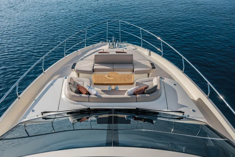Slide: The Image of Luxurious 2027 Absolute 70 Fly yacht deck with elegant seating and ocean view. - 22
