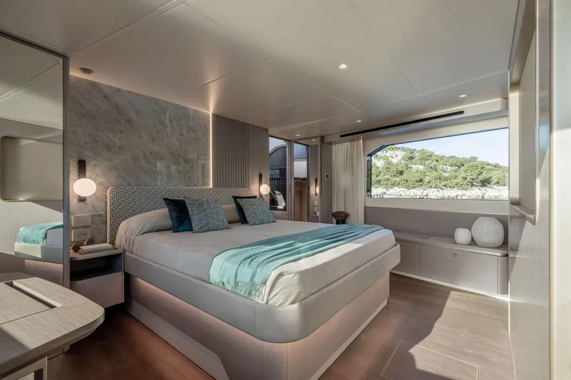 Slide: The Image of Luxurious bedroom interior of 2027 Absolute 70 Fly yacht with scenic window view. - 36