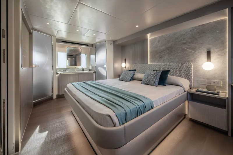 Slide: The Image of Luxurious bedroom interior on 2027 Absolute 70 Fly yacht, featuring modern design and elegant lighting. - 40