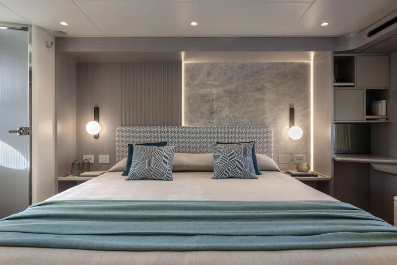 Slide: The Image of Luxurious bedroom interior on 2027 Absolute 70 Fly yacht, featuring modern design and ambient lighting. - 41