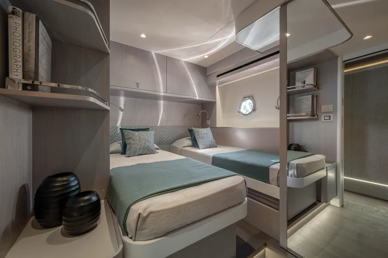 Slide: The Image of Luxurious twin cabin interior of 2027 Absolute 70 Fly yacht, featuring modern design and elegant decor. - 43