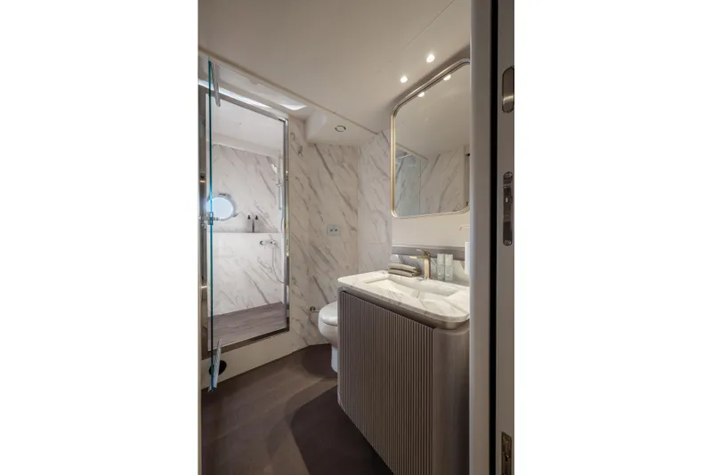 Slide: The Image of Luxurious bathroom on 2027 Absolute 70 Fly yacht with marble accents and modern fixtures. - 45
