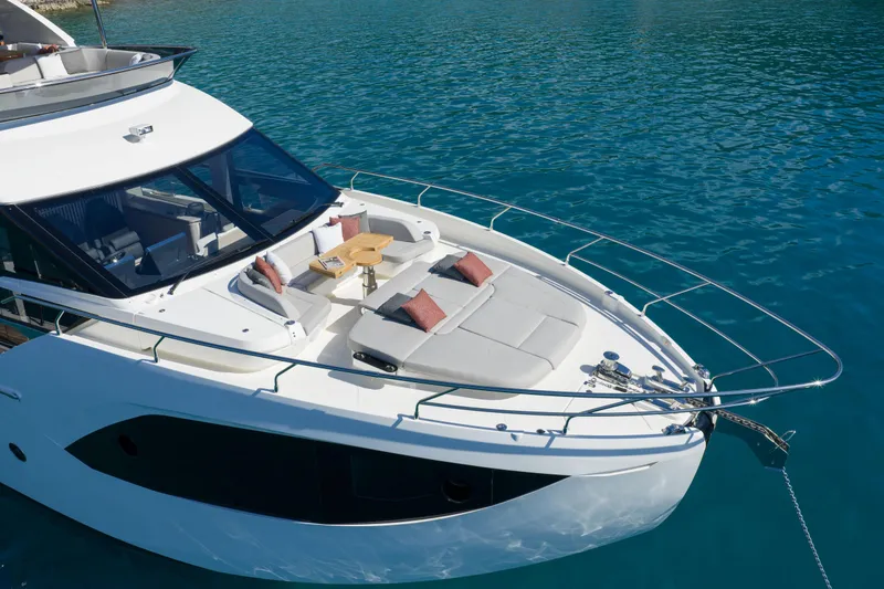 Slide: The Image of Luxury yacht with sun deck and cushions on calm water. - 19