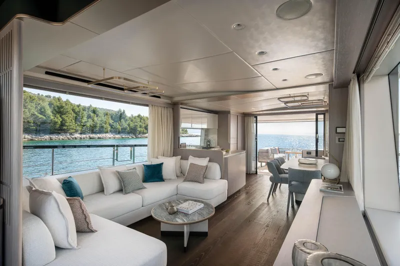 Slide: The Image of Luxurious yacht interior with white sofas and a sea view. - 28