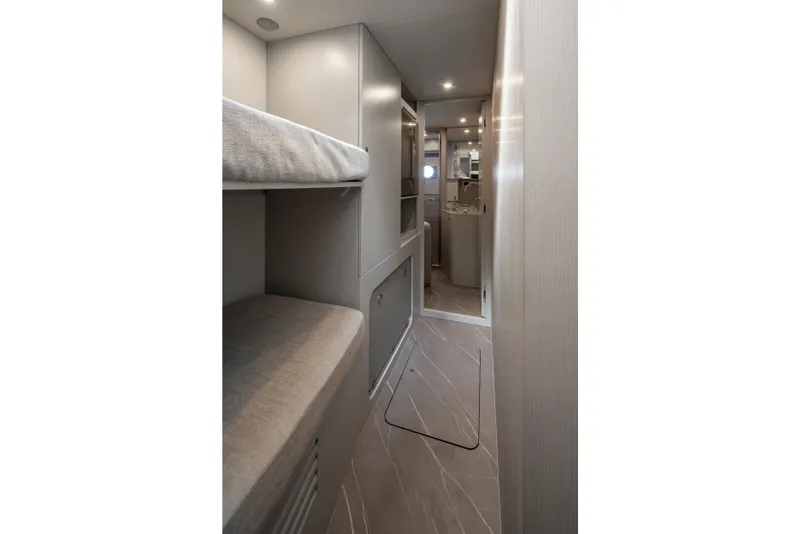 Slide: The Image of Interior of a modern boat with bunk beds and a bathroom. - 40