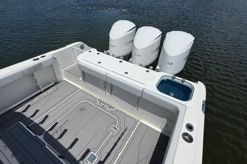 Slide: The Image of 2009 Everglades 350LX boat with Yamaha engines, featuring spacious deck and fishing amenities. - 11