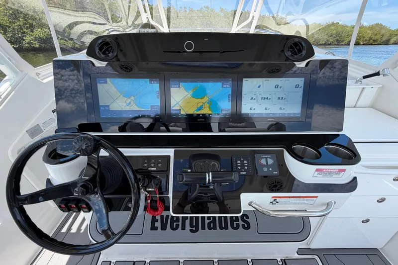 Slide: The Image of Cockpit of 2009 Everglades 350LX boat with advanced navigation displays and controls. - 29