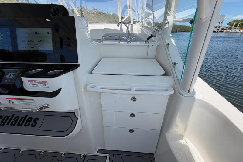 Slide: The Image of Interior view of a 2009 Everglades 350LX boat with control panel and sink. - 30
