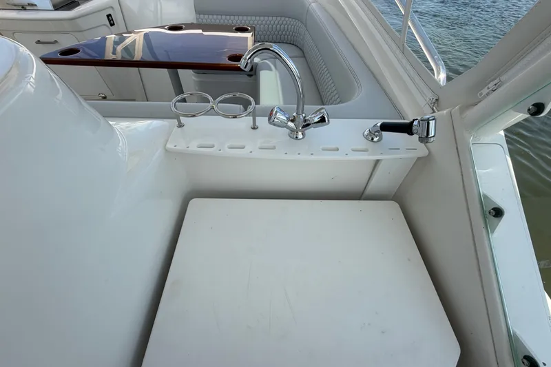 Slide: The Image of 2009 Everglades 350LX boat interior with sink and seating area. - 44