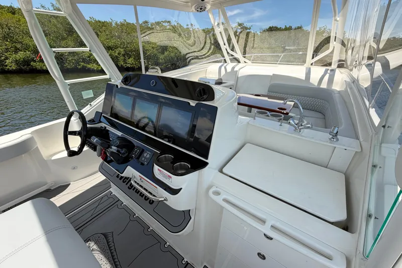 Slide: The Image of Cockpit of 2009 Everglades 350LX boat with modern controls and seating. - 45
