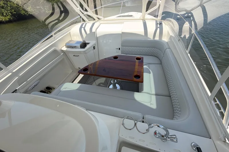 Slide: The Image of Luxurious seating area on a 2009 Everglades 350LX boat with elegant wood table. - 46
