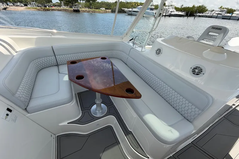 Slide: The Image of Luxurious seating area on a 2009 Everglades 350LX boat with elegant wood table. - 47