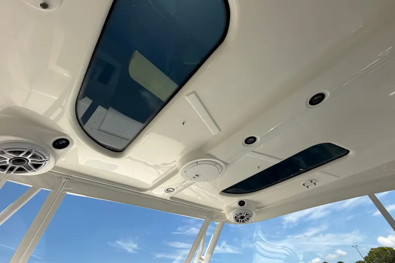 Slide: The Image of Interior view of 2009 Everglades 350LX boat roof with skylights and speakers. - 50