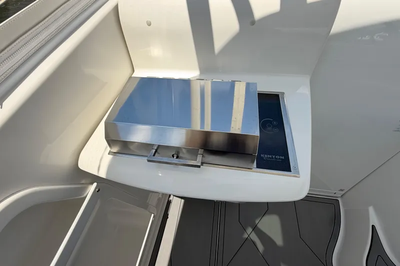 Slide: The Image of Built-in grill on 2009 Everglades 350LX boat, featuring Kenyon Custom design. - 51
