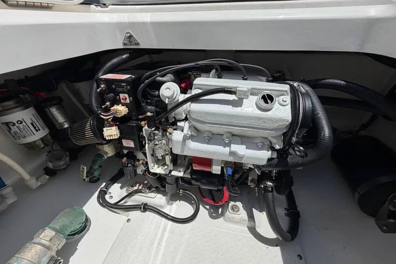 Slide: The Image of Engine compartment of a 2009 Everglades 350LX boat, showcasing detailed mechanical components. - 64