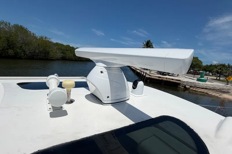 Slide: The Image of Radar equipment on 2009 Everglades 350LX boat, docked by a scenic waterway. - 71