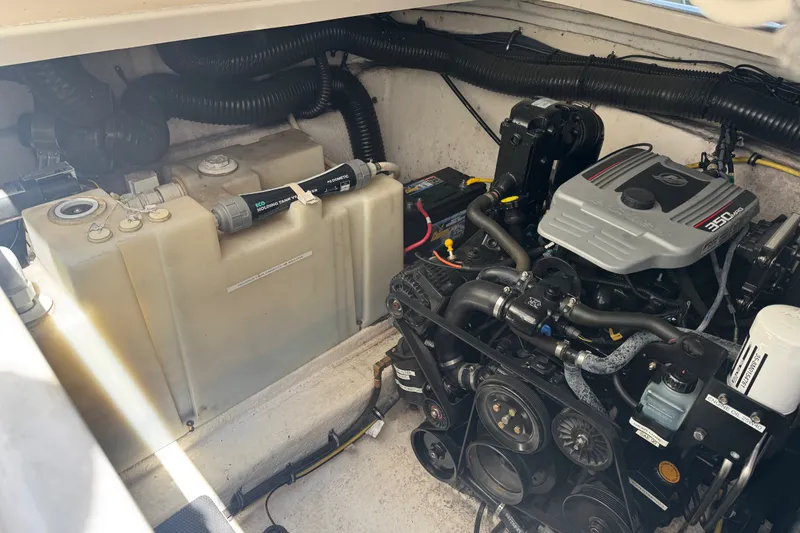 Slide: The Image of Engine compartment of a 2009 Chaparral Signature 330 boat, showcasing the engine and components. - 36