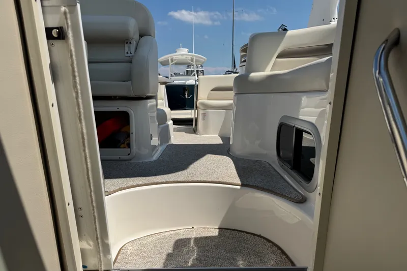 Slide: The Image of Interior view of 2009 Chaparral Signature 330 boat, featuring seating and storage compartments. - 34