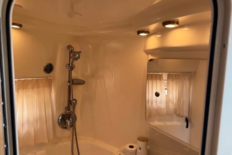 Slide: The Image of 2009 Chaparral Signature 330 bathroom with shower, mirror, and lighting. - 27