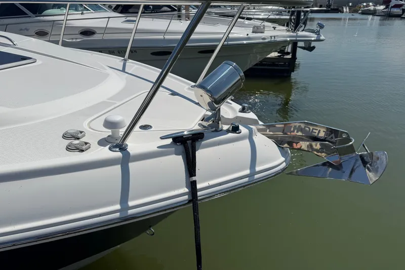 Slide: The Image of 2009 Chaparral Signature 330 boat with anchor, docked in marina. - 3