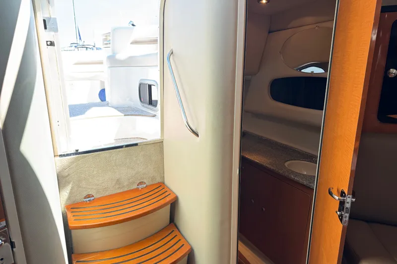 Slide: The Image of Interior view of 2009 Chaparral Signature 330 yacht, featuring stairs and cabin entrance. - 29