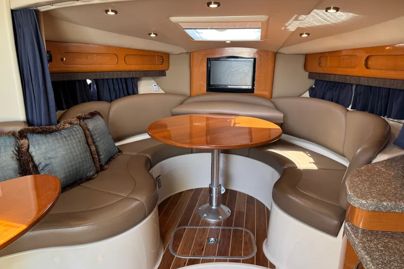 Slide: The Image of Luxurious 2009 Chaparral Signature 330 yacht interior with plush seating and elegant wood finishes. - 24