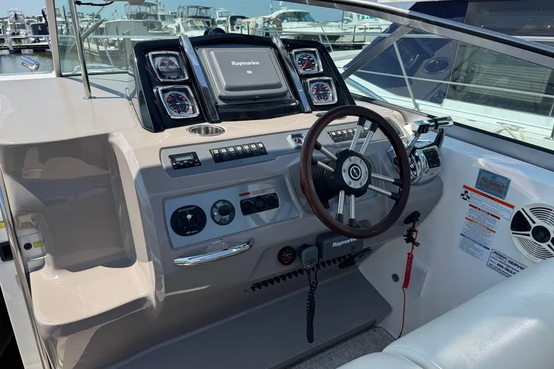 Slide: The Image of Helm of 2009 Chaparral Signature 330 boat with Raymarine navigation system and gauges. - 12