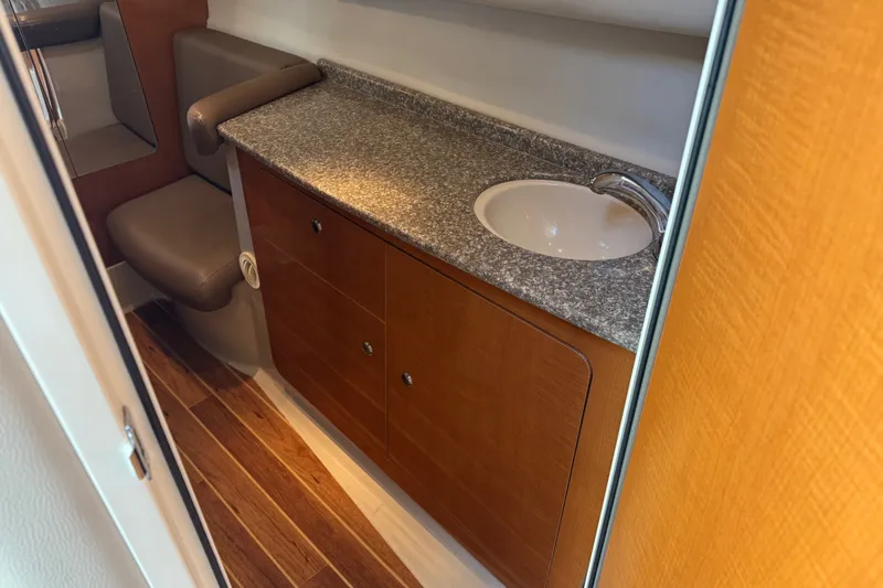 Slide: The Image of 2009 Chaparral Signature 330 interior with wood flooring, countertop, and sink. - 31