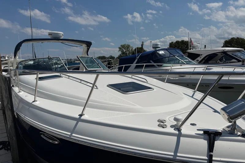 Slide: The Image of 2009 Chaparral Signature 330 boat docked under a clear blue sky. - 4