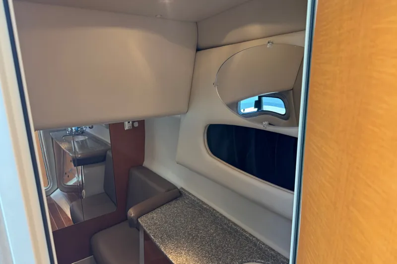 Slide: The Image of Interior cabin of 2009 Chaparral Signature 330 yacht with seating and window. - 30