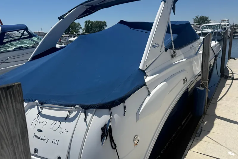 Slide: The Image of 2009 Chaparral Signature 330 boat docked with blue cover in Hinckley, Ohio. - 0