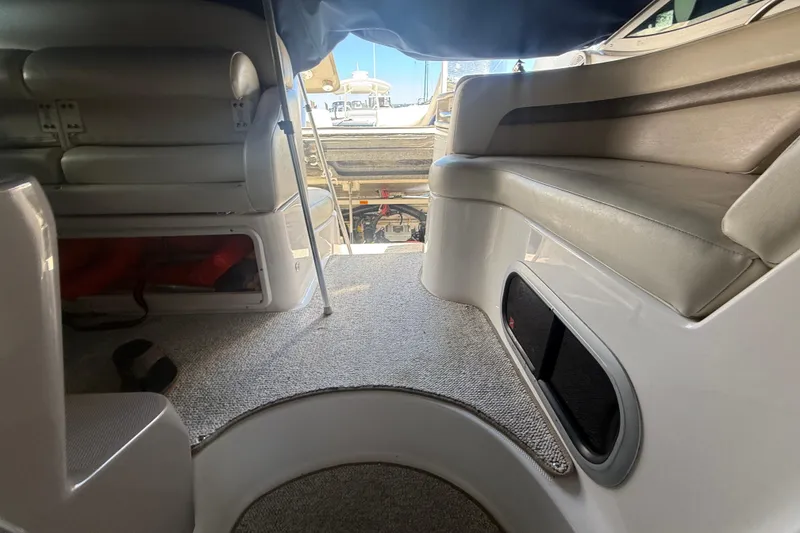Slide: The Image of Interior view of 2009 Chaparral Signature 330 boat with seating and carpeted flooring. - 13