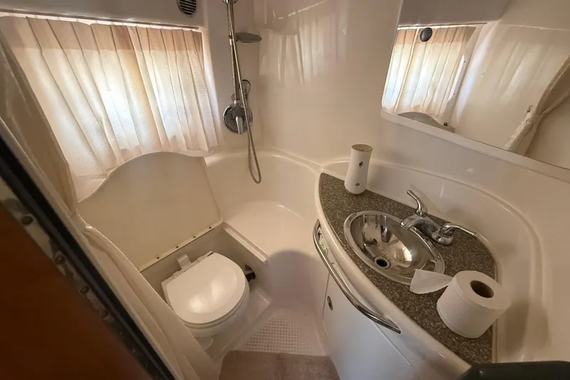 Slide: The Image of Bathroom interior of 2009 Chaparral Signature 330 boat with sink and toilet. - 16
