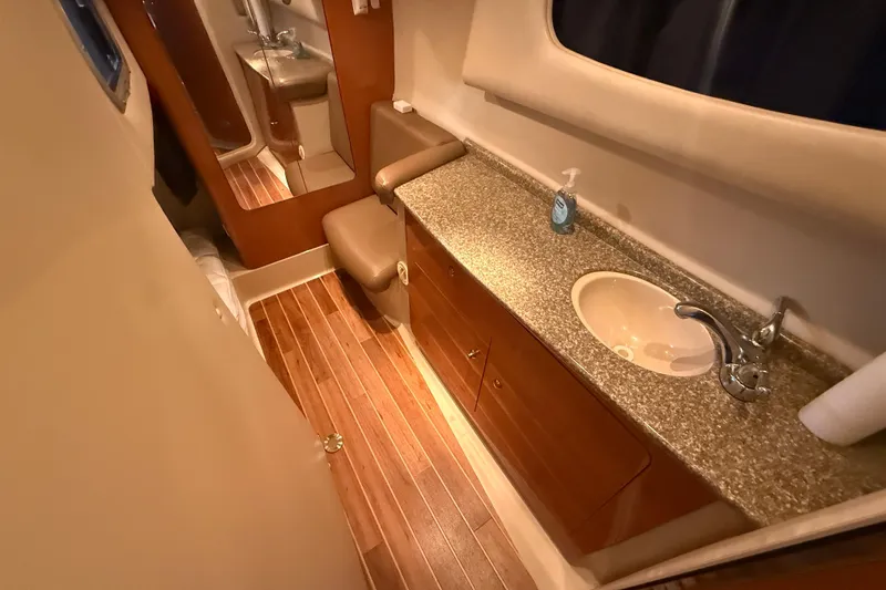 Slide: The Image of Luxurious bathroom interior of 2009 Chaparral Signature 330 yacht with wooden flooring. - 17