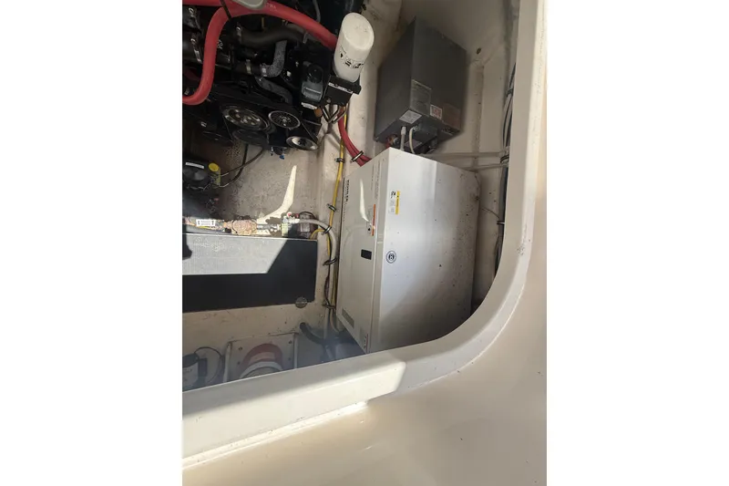 Slide: The Image of Engine compartment of a 2009 Chaparral Signature 330 boat, showing mechanical components. - 22