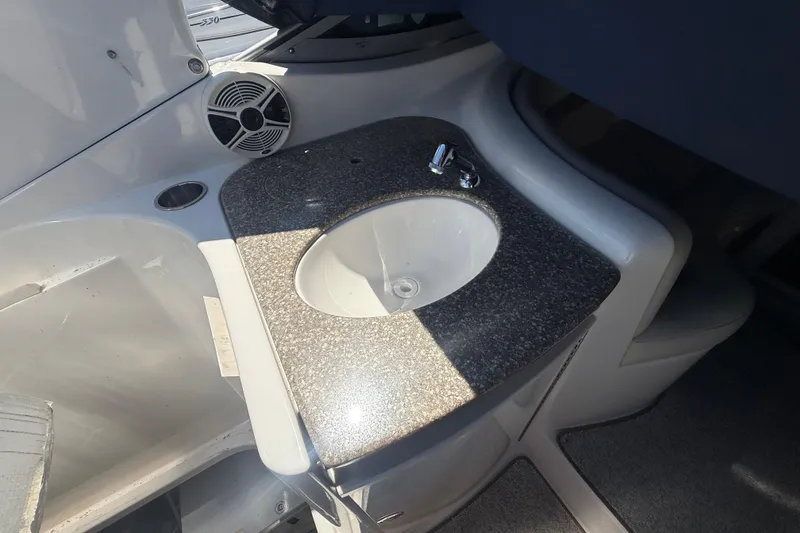 Slide: The Image of 2009 Chaparral Signature 330 boat interior with sink and countertop. - 7