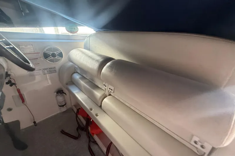 Slide: The Image of Interior of 2009 Chaparral Signature 330 boat with white seating and speaker. - 8