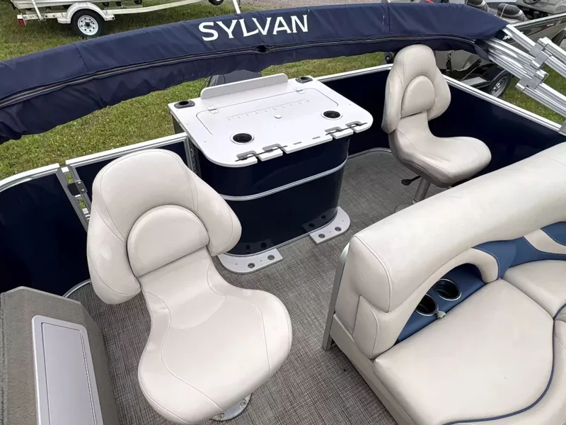 Slide: The Image of The image shows the interior of a 2016 Sylvan MIR 8520 CNF with comfortable seating. - 7