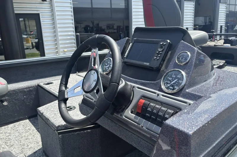 Slide: The Image of 2026 Ranger VS1782SC Angler boat dashboard with steering wheel and navigation controls. - 4