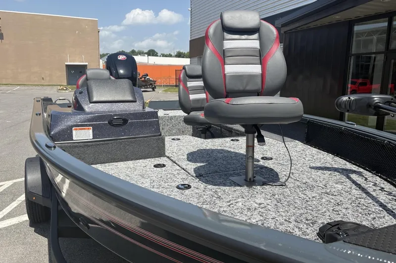 Slide: The Image of 2026 Ranger VS1782SC Angler boat with gray and red seating, parked outdoors. - 3
