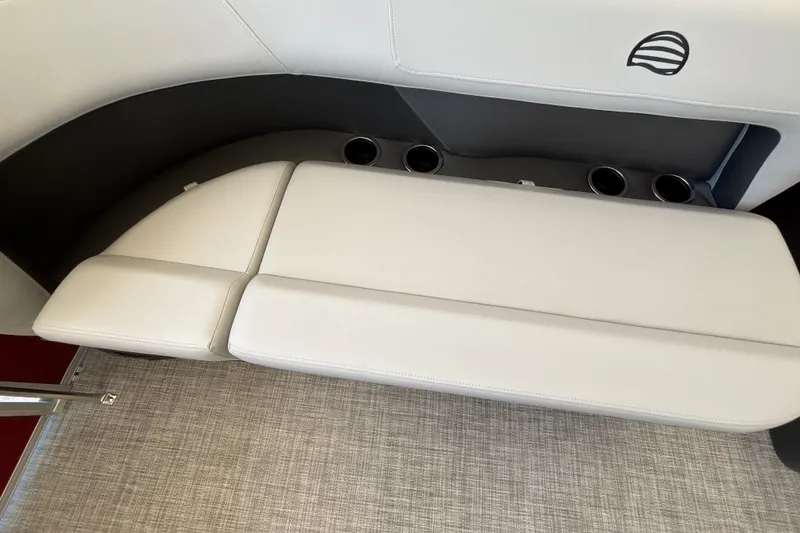 Slide: The Image of 2026 Sun Tracker Party Barge 16 DLX interior seating with cup holders and sleek design. - 23