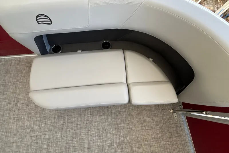 Slide: The Image of 2026 Sun Tracker Party Barge 16 DLX interior seating with cup holders and sleek design. - 18