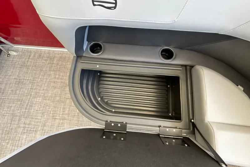 Slide: The Image of Interior storage compartment of 2026 Sun Tracker Party Barge 16 DLX with cup holders. - 20