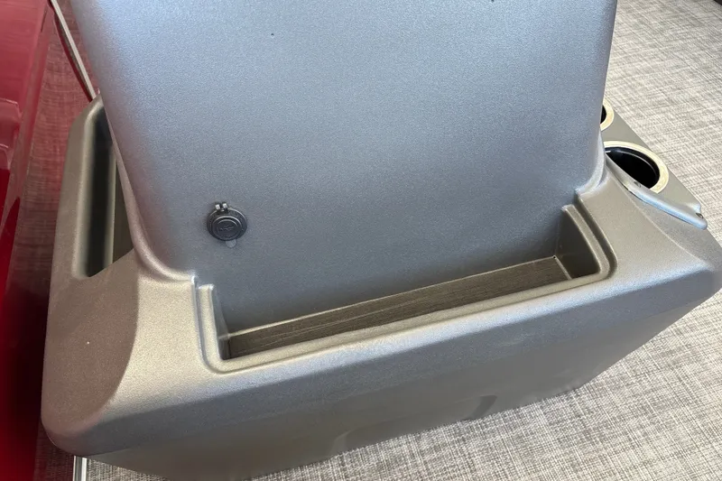 Slide: The Image of 2026 Sun Tracker Party Barge 16 DLX seat with integrated cup holders and storage compartment. - 14