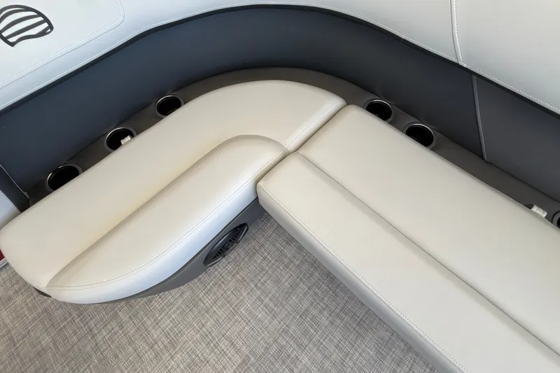 Slide: The Image of Interior seating of 2026 Sun Tracker Party Barge 16 DLX with cup holders. - 21